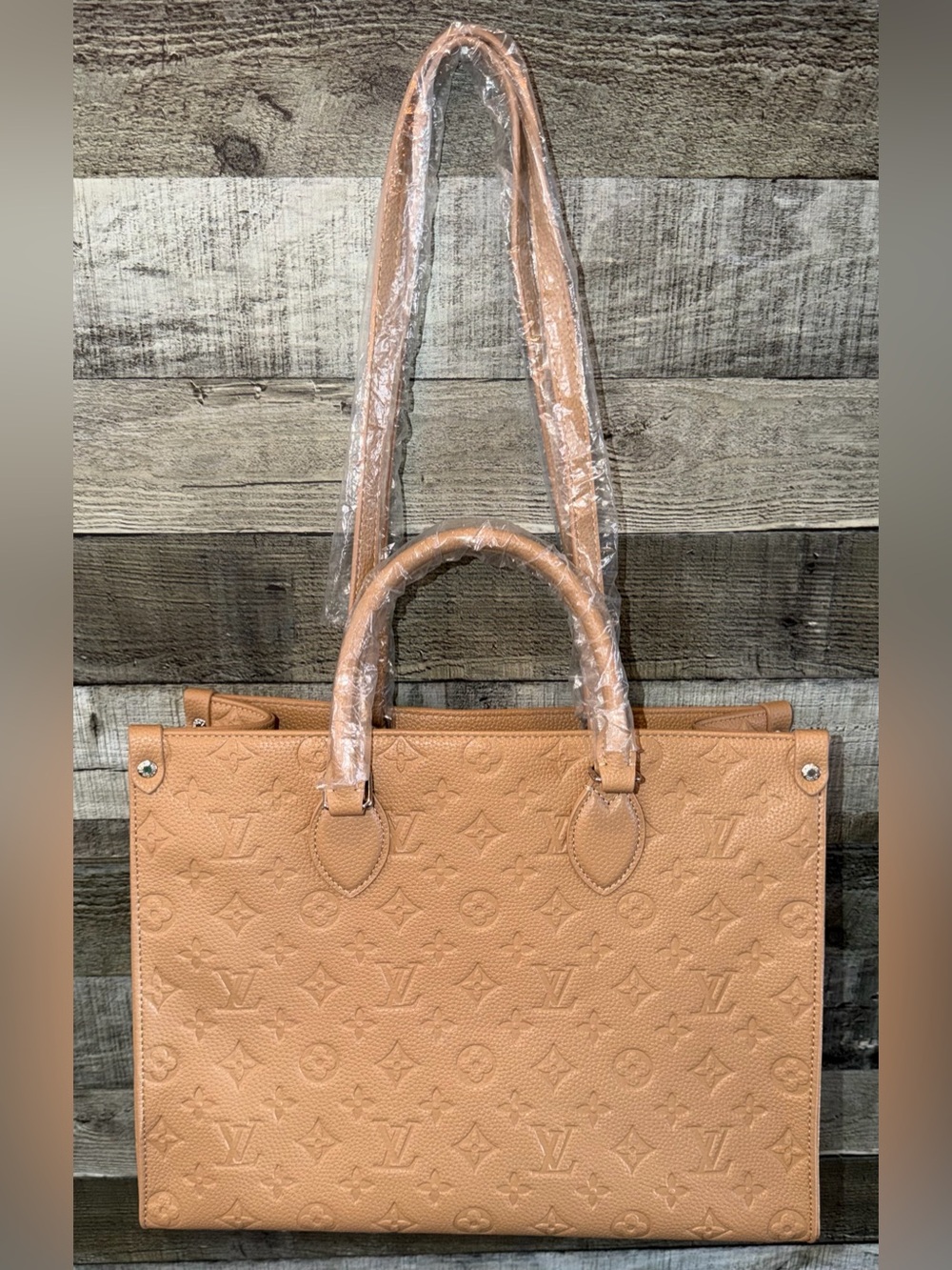 LV Tan OnTheGo MM Embossed Monogram Tote